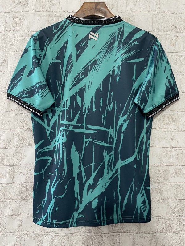 25/26 Tipperary GAA Teal with Warrior Silhouette and Abstract Brushstroke Pattern Jersey